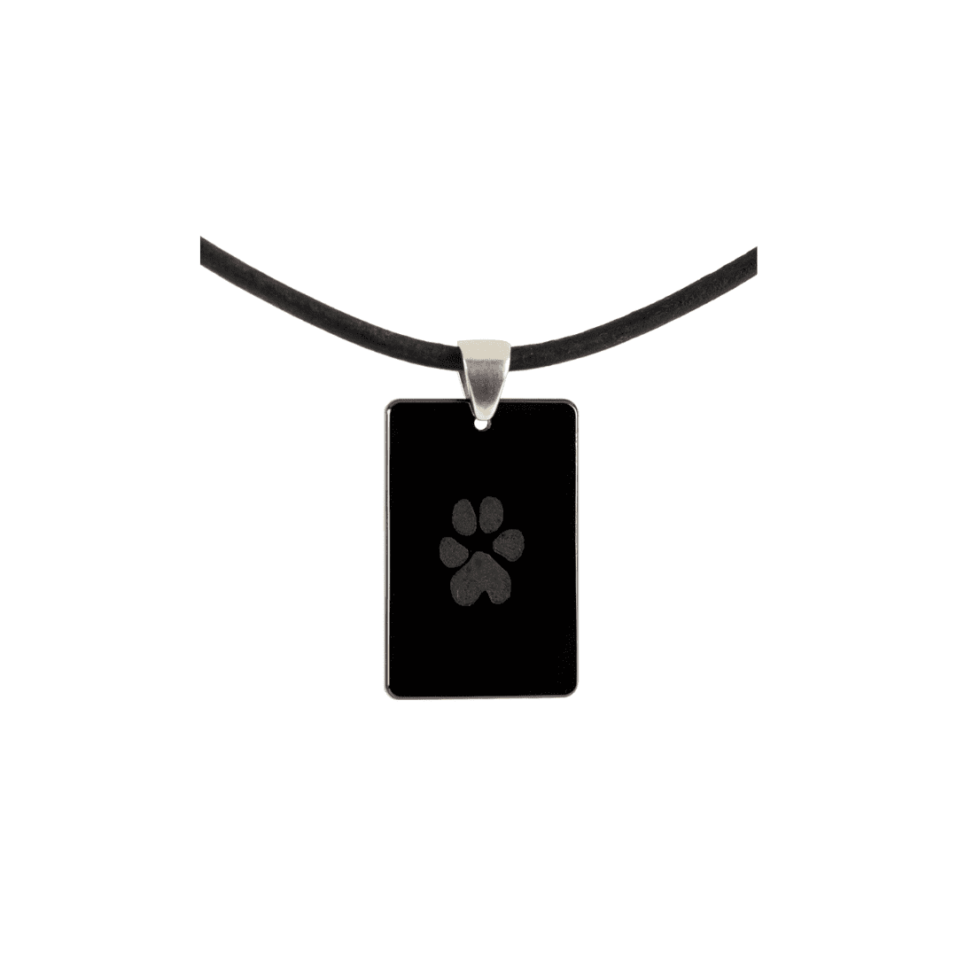 A black necklace with a paw print on it.