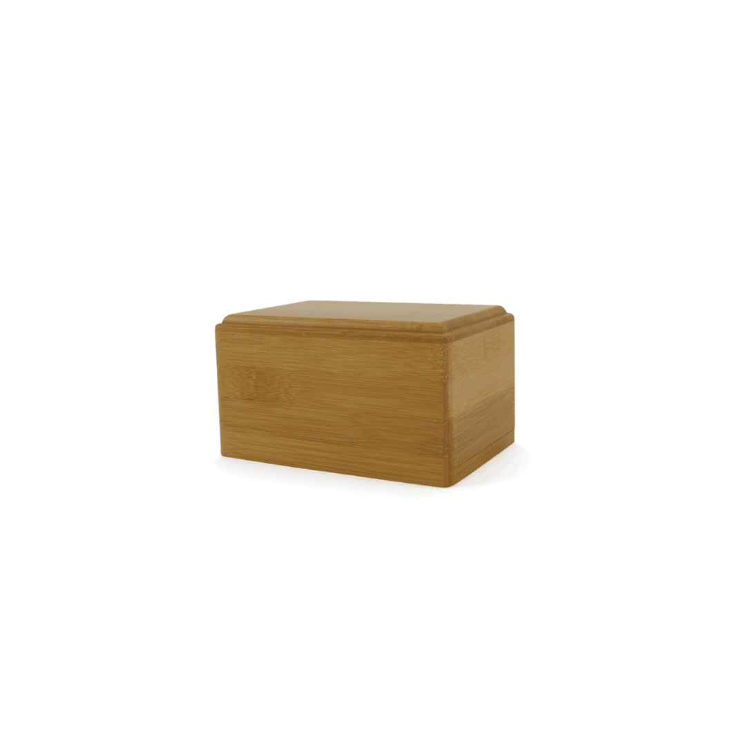 A wooden cremation urn on a white background.