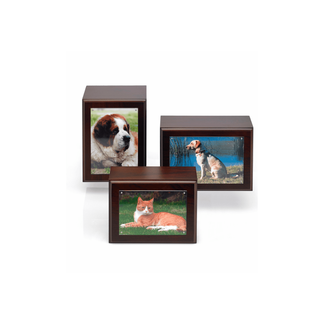 Three wooden urns with pictures of dogs on them.