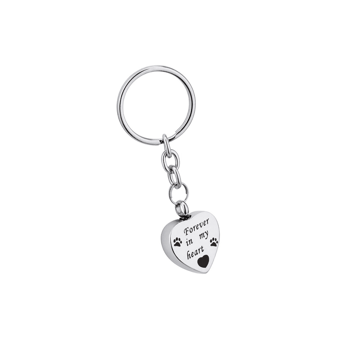 A heart shaped key chain with a paw print on it.