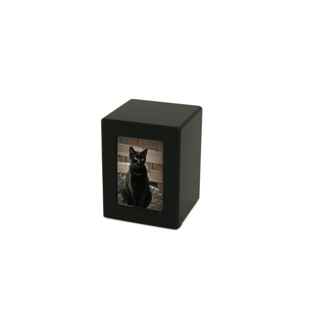 A black urn with a picture of a cat on it.